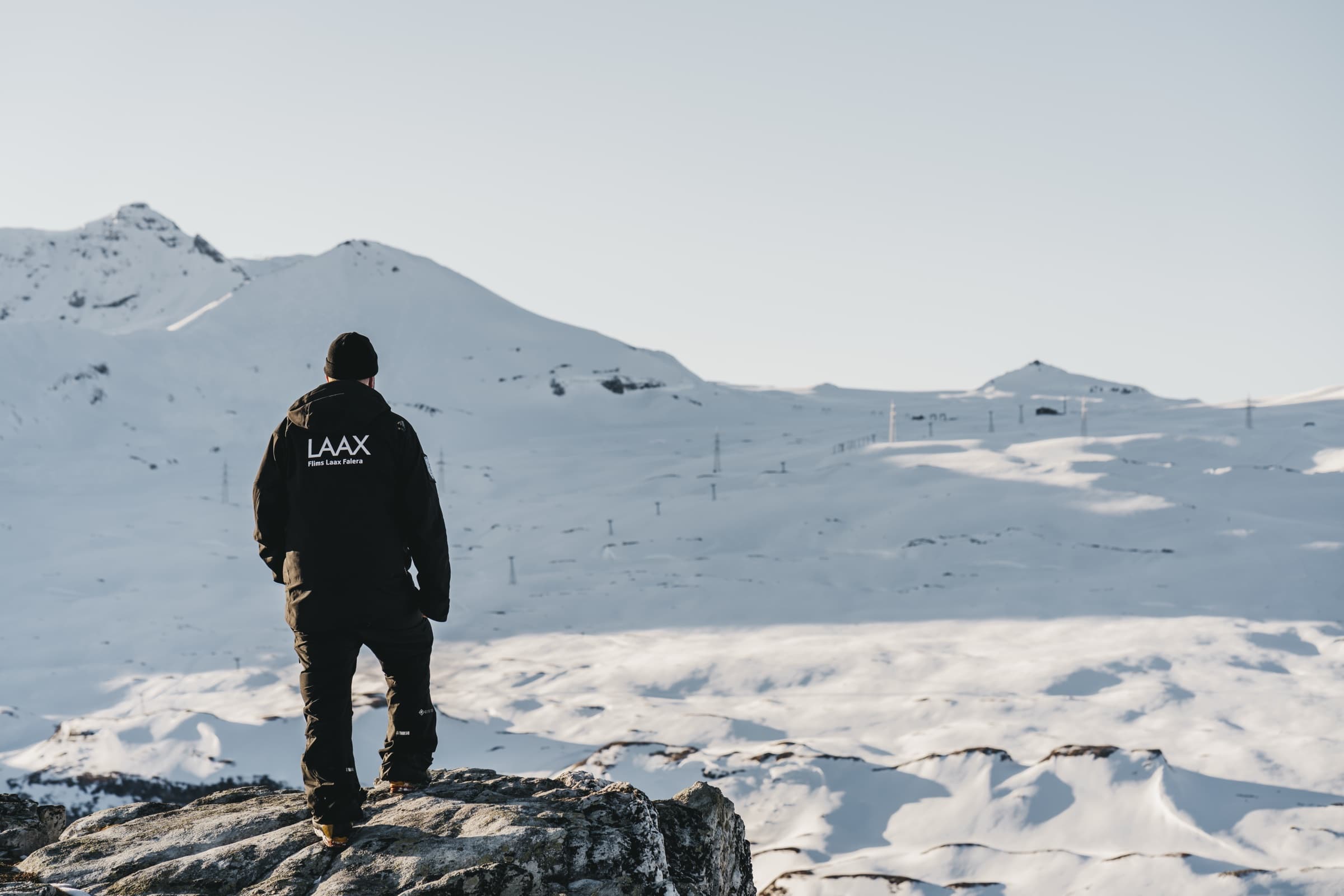 A LAAX team member overlooking the snow-covered resort